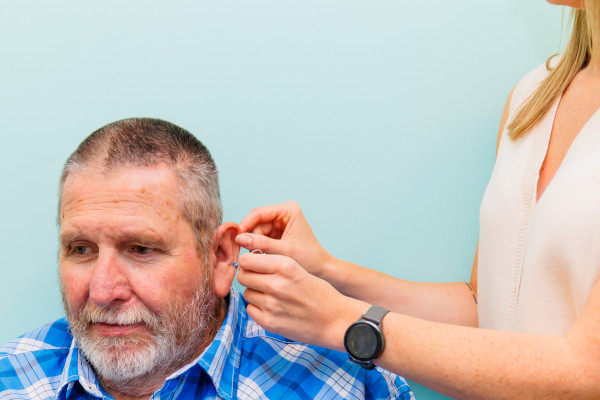 A patient being fitted for a hearing aid